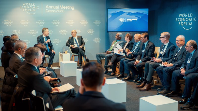 A speaker leads an engaged, close-format roundtable discussion among senior delegates during the World Economic Forum in Davos, Switzerland.